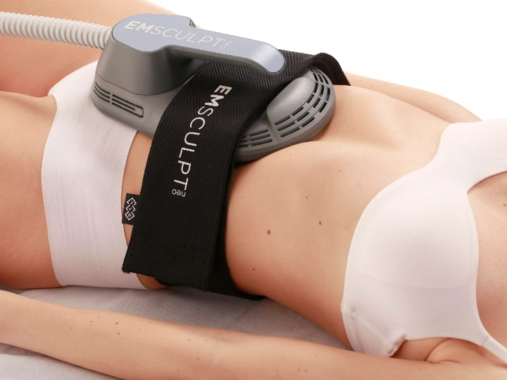 Photo of a woman getting Emsculpt treatments